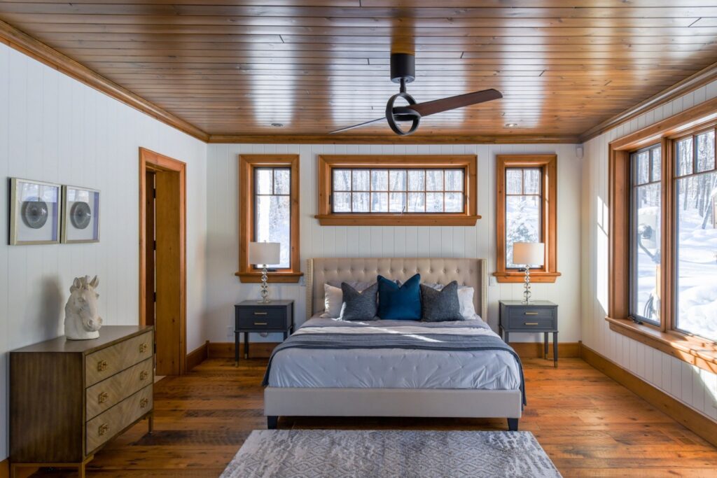 Custom-designed bedroom featuring natural wood finishes and warm textures by Bedrock Finishes.