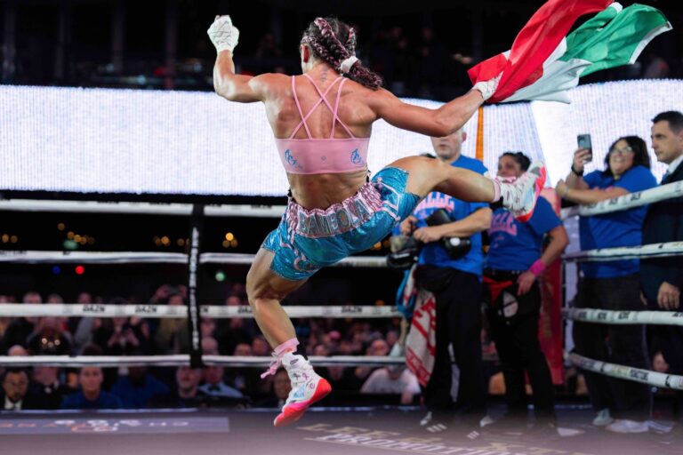 Mexican and Canadian hybrid flag held by Amanda Galle after the fight.