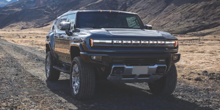 Front view of the 2025 Hummer EV parked in a rugged landscape.