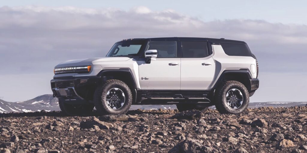 Side view of the 2025 Hummer EV in white, showcasing its modern and bold design.